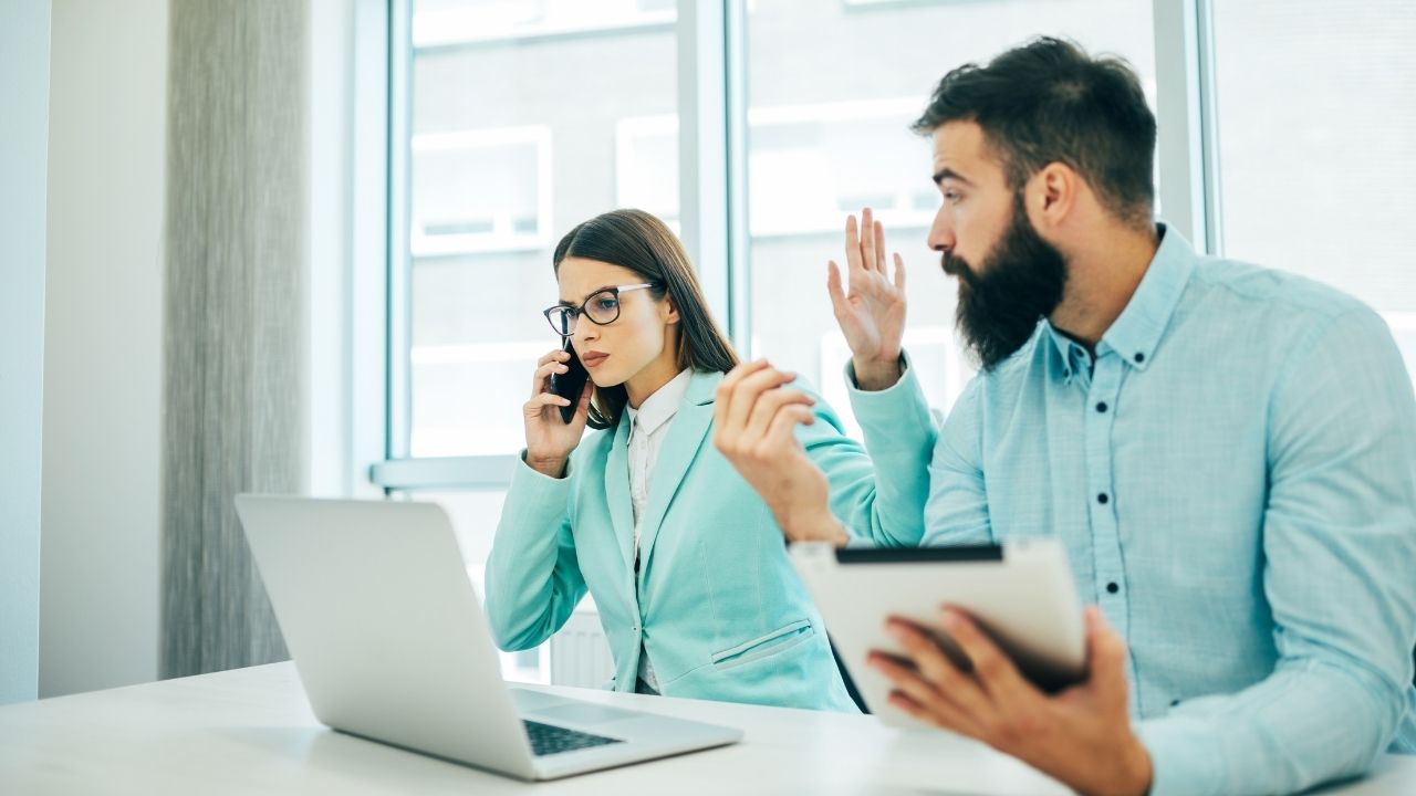 woman and man arguing at work
